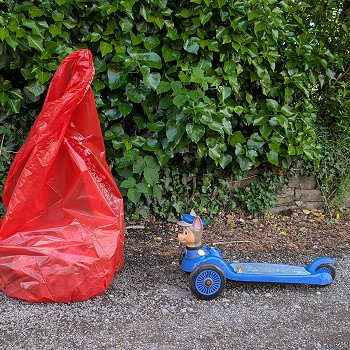 a bag of litter and discarded plastic toy
