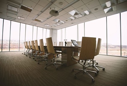 empty boardroom with tables and chairs