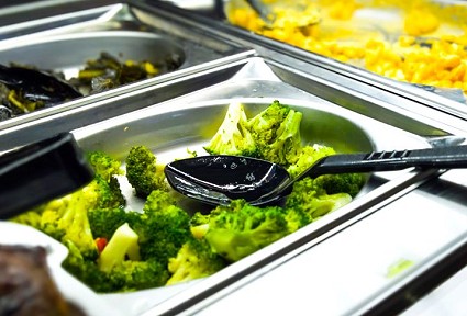broccoli with a black spoon
