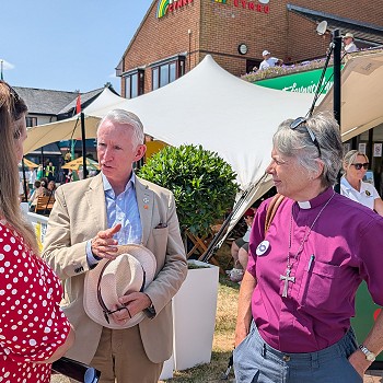 Sioned speaking with a chaplain and a man