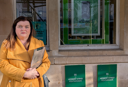 Sioned Williams MS stands outside Lloyds Bank in Pontardawe