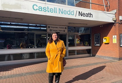 sioned williams standing outside neath railway station