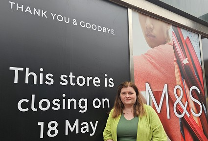Sioned Williams in front of a M&S sign