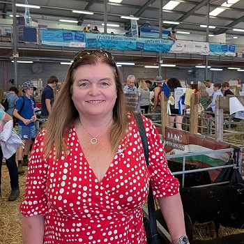 Sioned next to the sheep pens