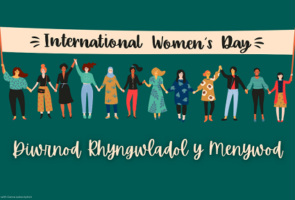 Petryal gwyrdd tywyll gyda graffig o lawer o ferched gwahanol yn y canol. Maen nhw'n sefyll o dan faner sy'n dweud 