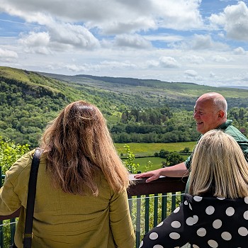 Sioned and Beca with hosts looking across the valley